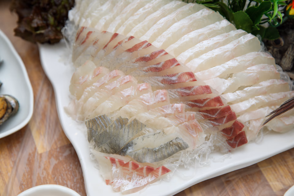 Cho-gochujang, soy-wasabi, and sesame oil condiment trio beside sashimi