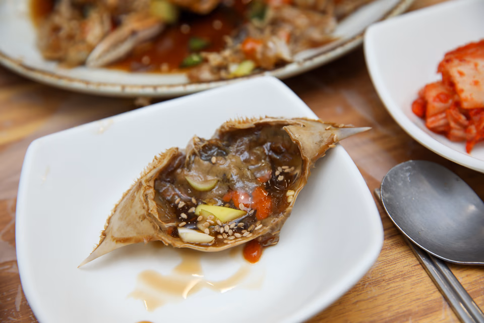Rice mixed into crab shell with orange roe, the signature gejang technique