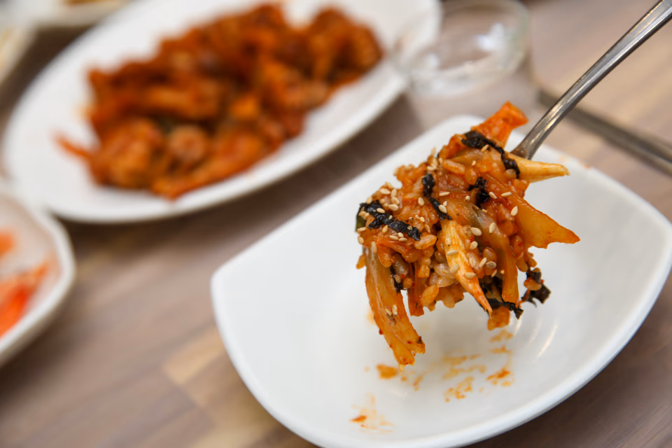 Plated grilled hagfish with nutritional callouts, protein, collagen, iron