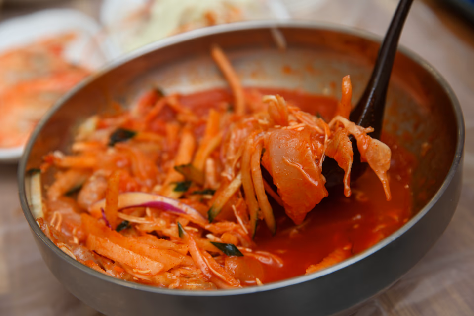 Side-by-side comparison, mulhoe with icy broth on the left, hoe-deopbap rice bowl on the right