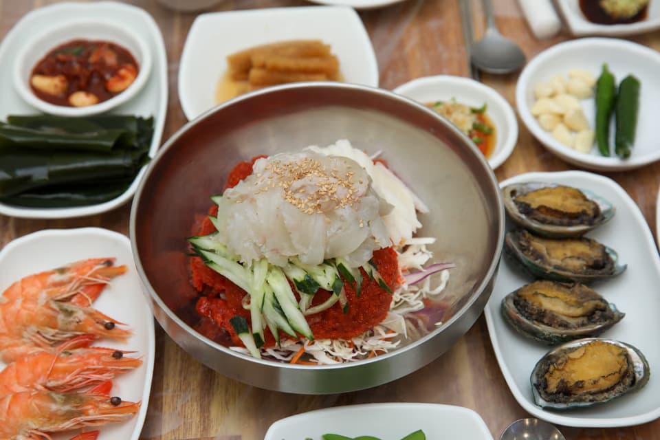 Premium mulhoe served at Sujeong Hoejib with thick-cut squid and flatfish