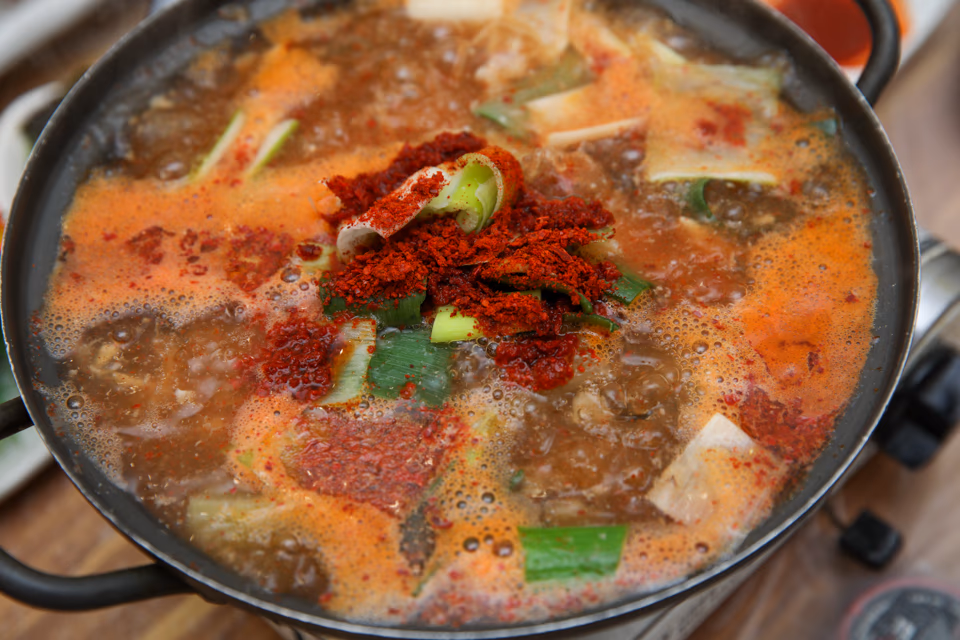 Bubbling pot of seodeori-tang, red fish bone stew with tofu and vegetables